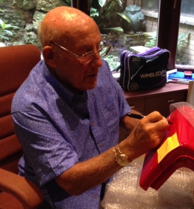 Sir Sterling Moss signing one of our vintage pumps We have some great items signed by the legend 
