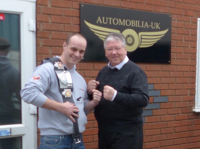Boxing champ visits showroom