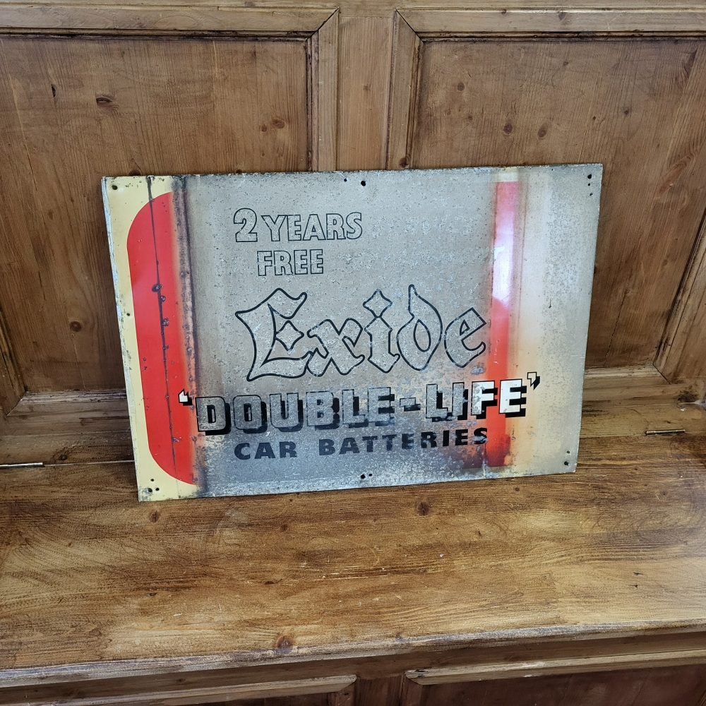 A EXIDE tin sign well worn and faded 24 x 17 inch